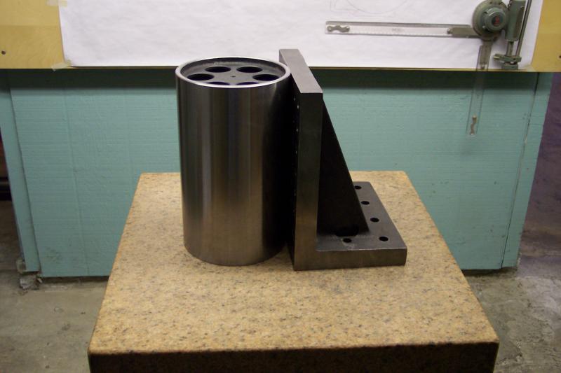 A cylindrical master square calibrating an angle plate.