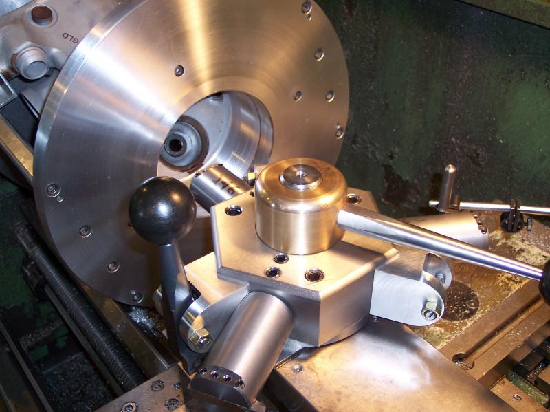 A three station tool turret for threading aircraft heads